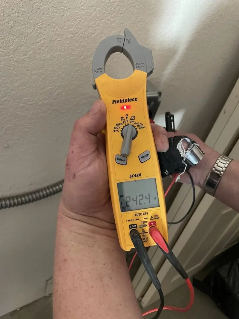 Voltage testing with clamp meter during Generator Installation in West Vero Corridor